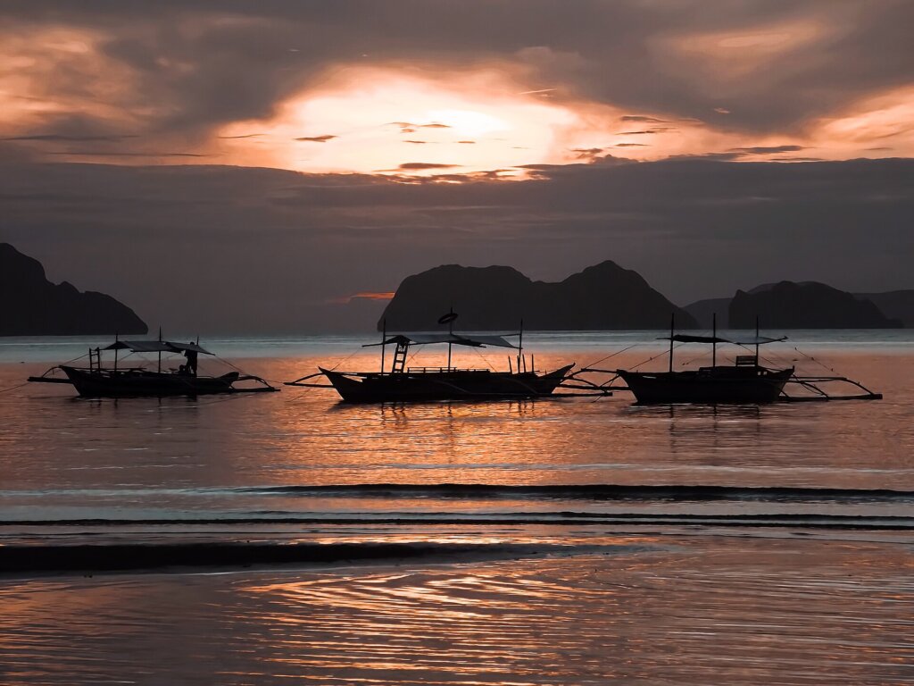 Boats at sunset in El Nido bay