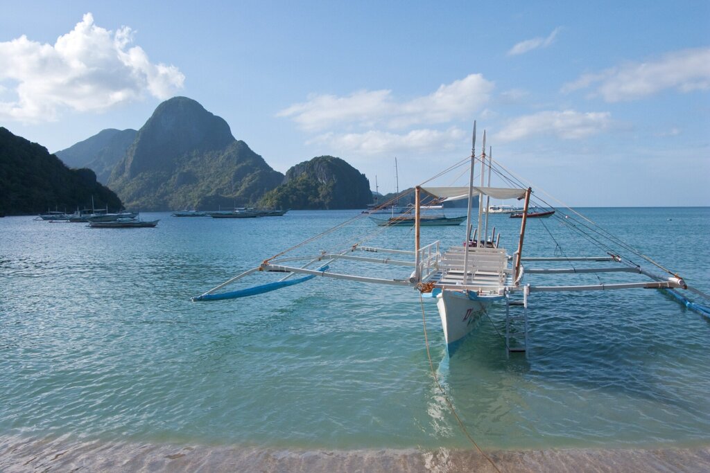 Calm Corong Corong Beach with boats, a quieter El Nido base for sensory-sensitive families