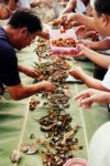 Boodle fight feast laid out on banana leaves