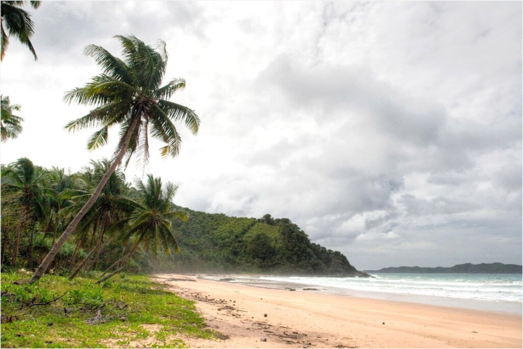 The open shoreline and surf break at Duli Beach near El Nido, Palawan