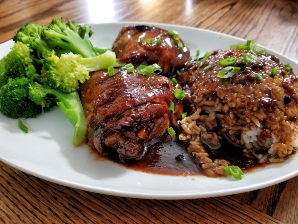 Chicken adobo, a Filipino dish commonly served on El Nido island hopping boat lunches