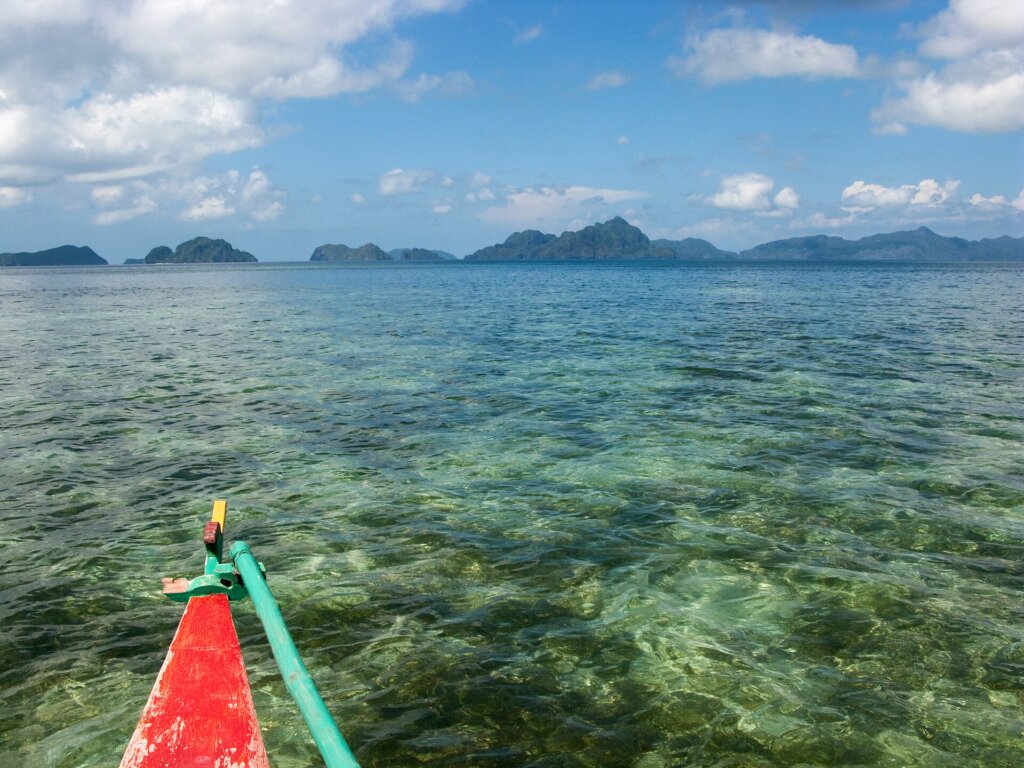 El Nido Bay with limestone islands and boats, Palawan