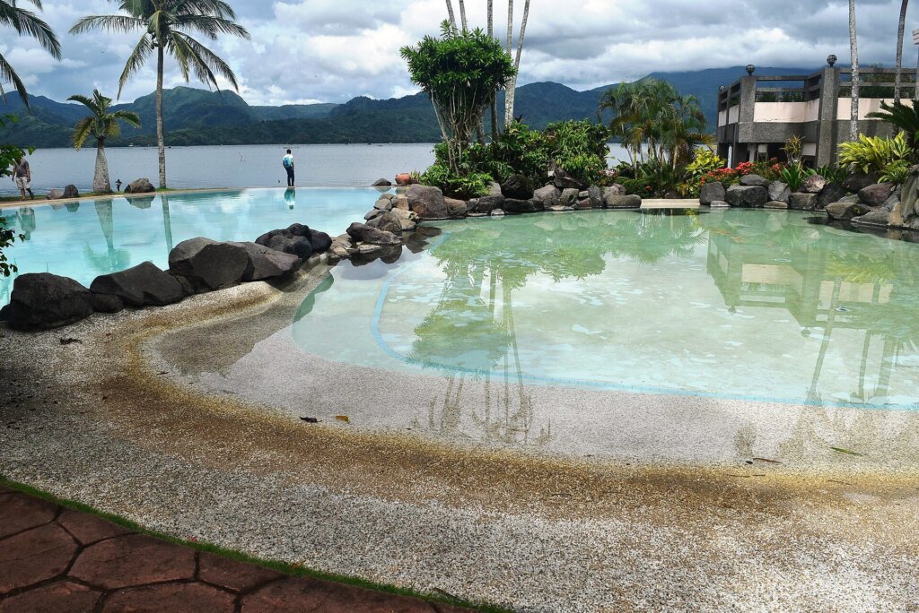Infinity pool at a tropical resort, illustrating El Nido hotels with private pools