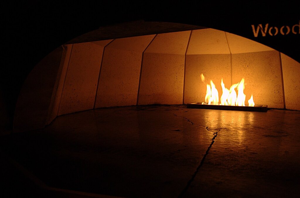 Wood-fired pizza served at a casual restaurant table