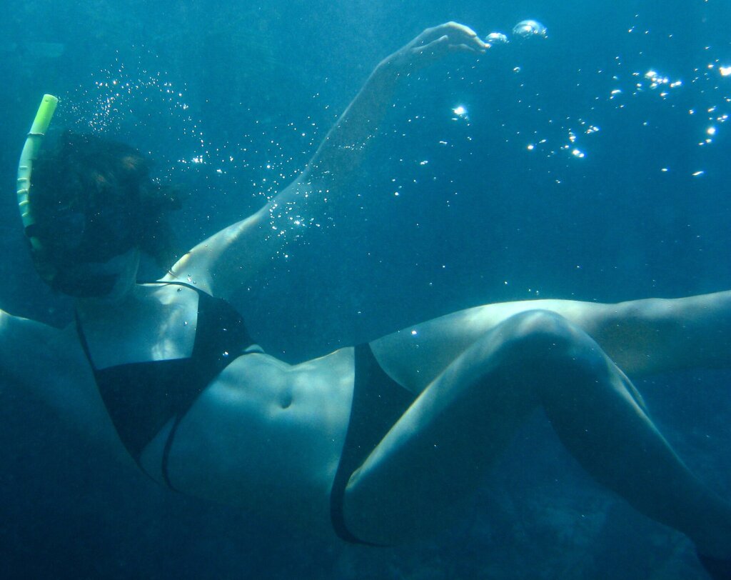 Snorkeler underwater wearing a mask
