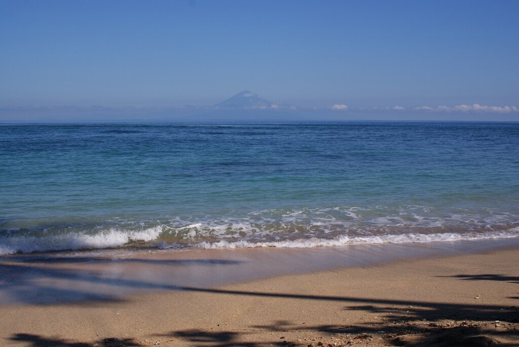 Senggigi Beach in Lombok with Mount Agung across the strait