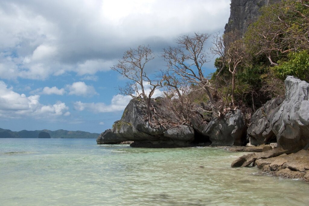Rocky shoreline at Corong Corong Beach in El Nido, Palawan