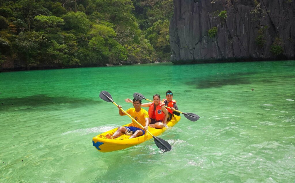 A kayaker paddling near Cadlao Island in El Nido, Palawan