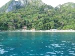 Seven Commandos Beach in El Nido with palm trees and turquoise water