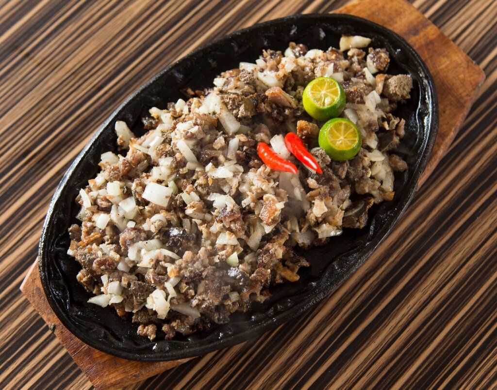 Sizzling sisig plate, a Filipino dish found in El Nido restaurants