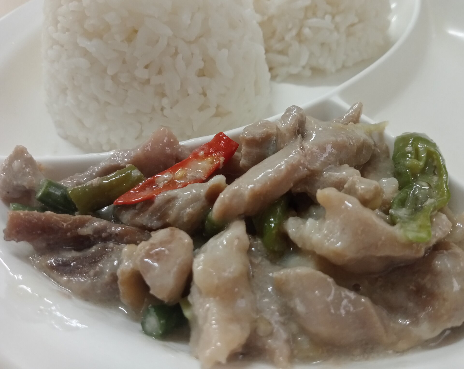 Bicol Express pork in coconut milk with chilies served with rice